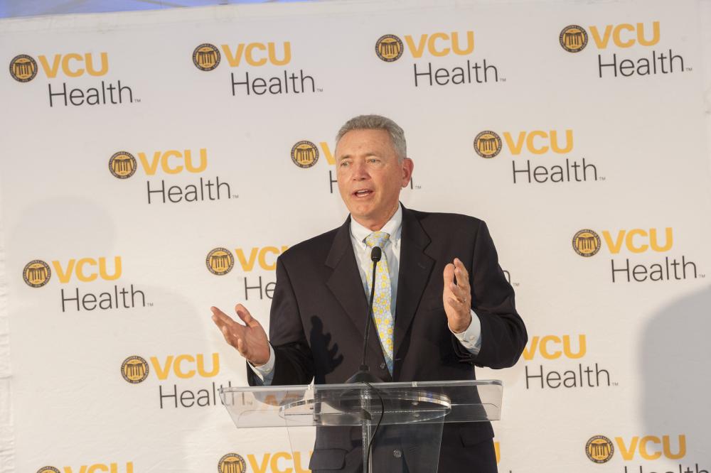 George Emerson, who serves on our board of trustees, the Massey Cancer Center Advisory Board and VCU Health System Authority Board of Directors, delivers remarks at the groundbreaking for VCU Health’s new outpatient facility, which is on the largest capital construction project in the health system’s history. Photo: Thomas Kojcsich, VCU University Marketing.