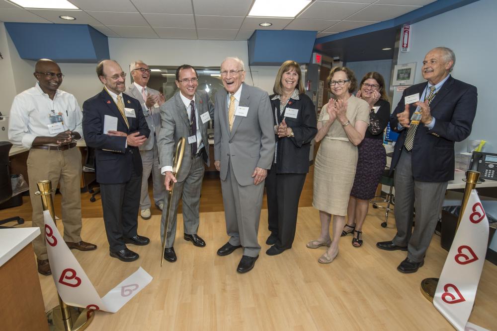 VCU Health leaders and supporters cut the ribbon to the new Cardiac Imaging Suite on July 17. (L to R) Vigneshwar Kasirajan, M.D., chair of the Department of Surgery; Ken Ellenbogen, M.D., chair of the Division of Cardiology; Peter Buckley, M.D., dean of the School of Medicine; William Hundley, M.D., director of the Pauley Heart Center; Stan Pauley; Kathy Pauley Hickok; Marsha Rappley, M.D., vice president for health sciences and CEO of the VCU Health System; Deborah Davis, CEO of VCU Health System Hospitals and Clinics; and Gordon Ginder, M.D., director of the Massey Cancer Center. Photo: Kevin Morley, VCU University Marketing