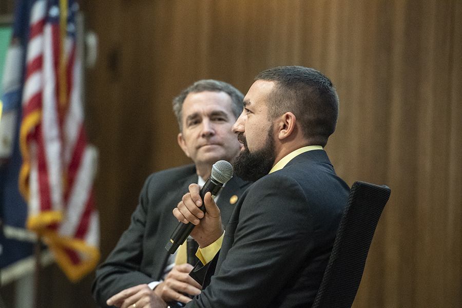 Ryan Hall speaks with Governor Ralph Northam in front of MCV Campus students, faculty and staff about his struggle with opioid addiction, which began after he sufferred an injury at a high school football game. Photo: Allen Jones, VCU University Marketing