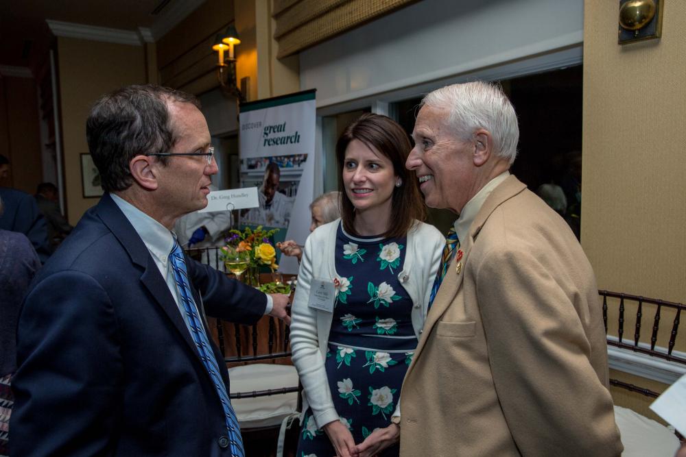 Gregory Hundley (left), M.D., director of the Pauley Heart Center and director of cardiac imaging at VCU Health, discusses his contributions to the Discovery Series panel with Williamsburg resident and Discovery Society member Bob Hershberger and Carrie Mills, senior major gift officer at VCU Health.