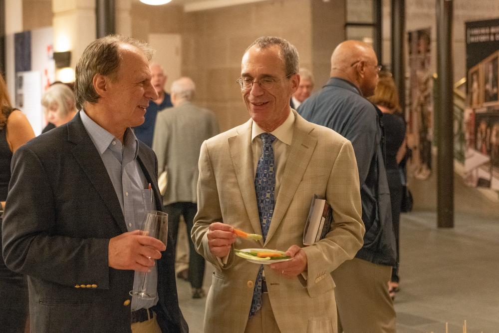 John M. Barry (left), author of “The Great Influenza: The Story of the Deadliest Pandemic in History,” and Michael Donnenberg, M.D., senior associate dean for research and research training, and professor of internal medicine at the VCU School of Medicine, discuss John’s book after the two participated in a panel at the Virginia Museum of History and Culture. Photo: Troy Wilkinson, courtesy of Virginia Museum of History and Culture.