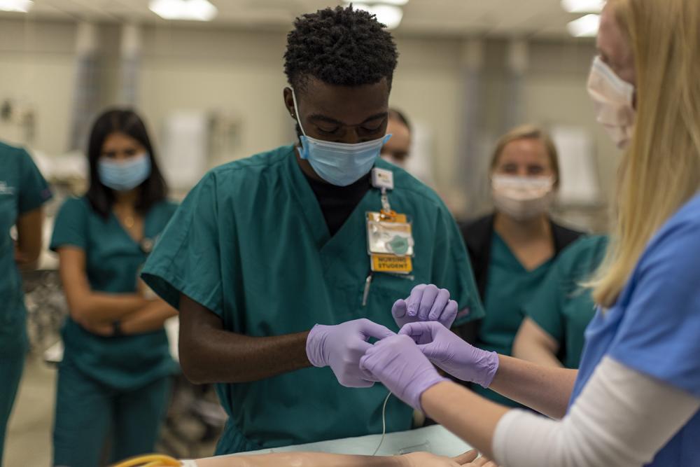 School of Nursing students practice in the lab