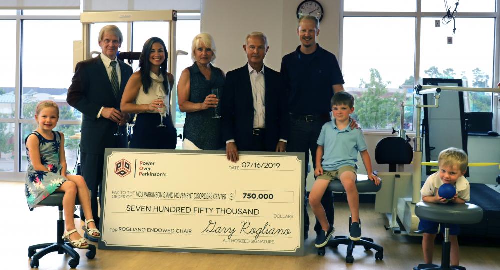 Angela and Gary Rogliano (center) celebrate with their daughter, Margaret Preston (center left); son-in-law, Adam Preston (center right); grandchildren, Samantha, Nicholas and Benjamin Preston; and friend, Mike Grappone.