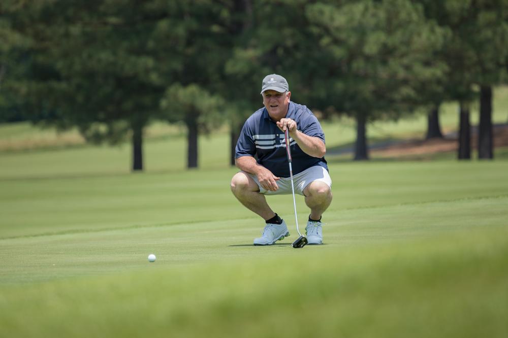 One of the 72 golfers who participated in June’s Harper’s Hope Golf Tournament and Auction sizes up a putt. Golfers and auction participants raised approximately $45,000 at this year’s event.