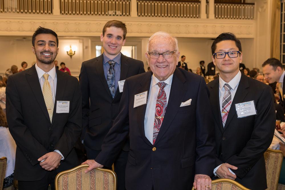 Ken Wright, one of VCU Health’s most generous benefactors, stands with the C. Kenneth and Dianne Wright Physician-Scientist Scholars at the 2019 MCV Campus Endowed Scholarship Brunch. The scholars are (L to R) Teja Devarakond, Graeme Murray and Eric Kwong.
