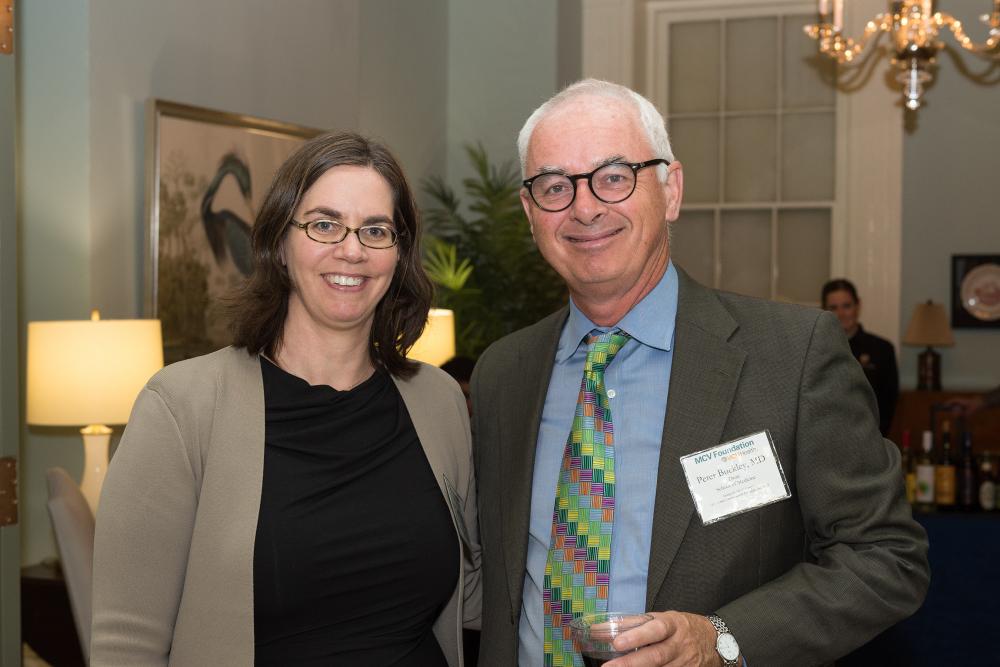 April Kimmel, Ph.D., and Dean Peter Buckley of the VCU School of Medicine.