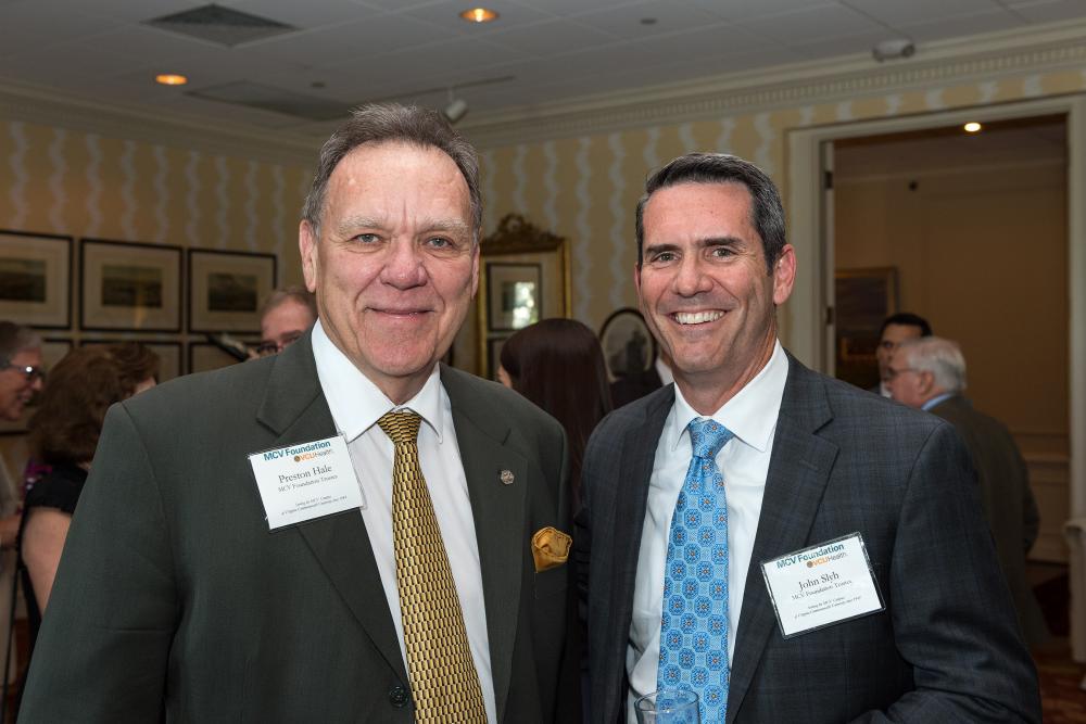 Preson Hale (left) spends time with fellow board member John Slyh at Preston’s final annual awards dinner before rolling off our board and joining the Leadership Council.