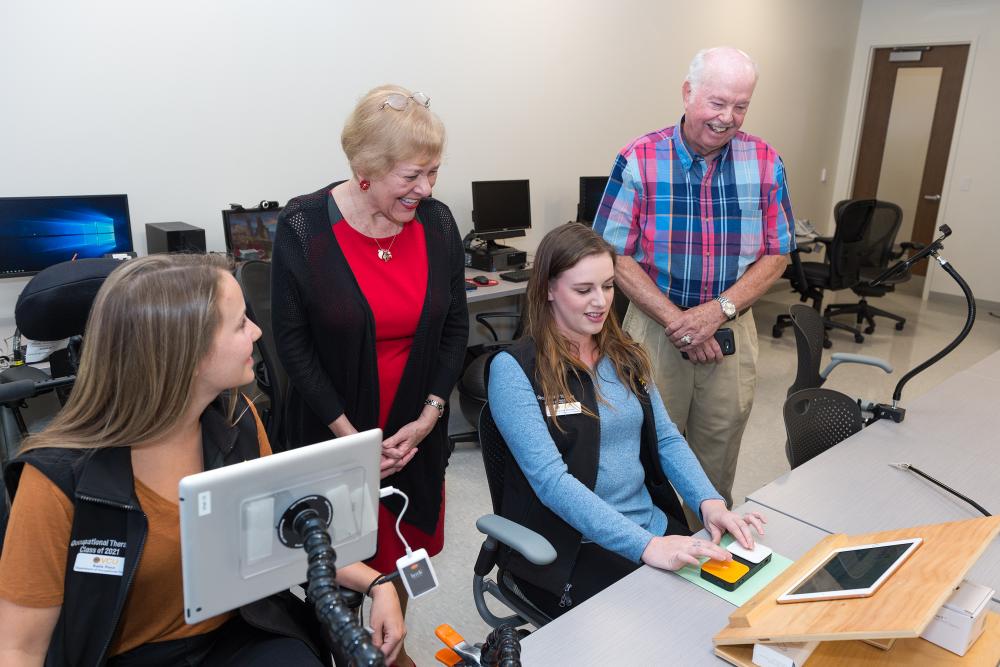 Jack and Carlyn Dalness interact with occupational therapy students in the VCU College of Health Professions Herbert and Charlotte Meyer Assistive Technologies Laboratory & Quiet Room, which was named in honor of a WWII veteran wounded during the D-Day invasion of 1944 who benefited from OT treatment. Photo: Kevin Schindler