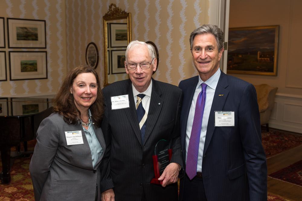 James Shield Jr., M.D. (center), holds his Dowdy Award alongside Margaret Ann Bollmeier, MCV Foundation president, and Harry Thalhimer, MCV Foundation board chair, at our annual dinner and awards ceremony.