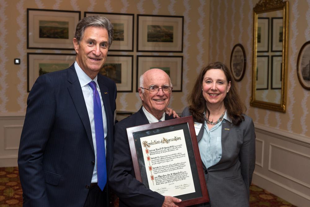 Harry Young, M.D. (center), who wasn’t able to attend last year’s annual dinner when he was awarded lifetime honorary trustee status, stands this year with Harry Thalhimer and Margaret Ann Bollmeier after receiving his proclamation.