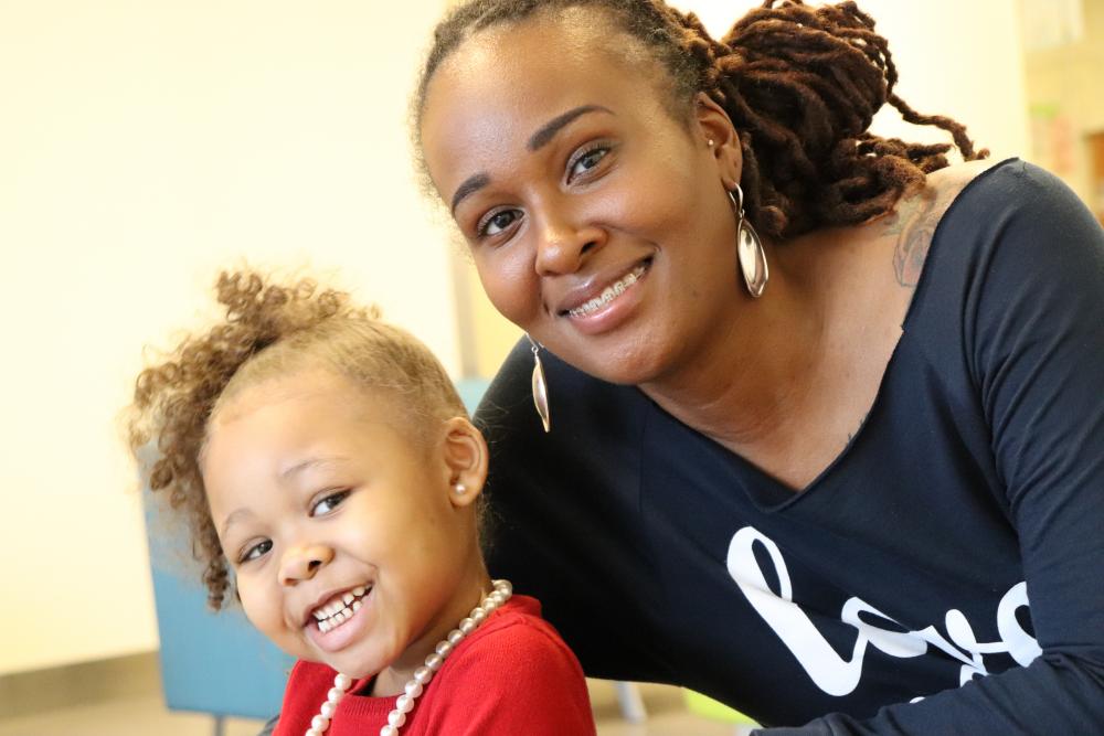 Dionne Bobo waits with her daughter Jaylen Williams before meeting with a doctor at CHoR. Both Jaylen and her brother Jadien have sickle cell disease.