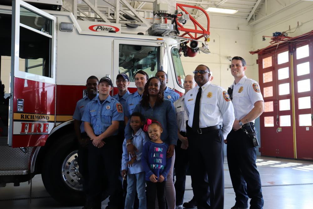 Richmond Fire Chief Melvin Carter (second from right), along with Richmond Fire and Emergency Services personnel at Fire Station No. 17, Gather with Dionne Bobo and her children Jaylen and Jadien. Jaylen and Jadien both have sickle cell disease.