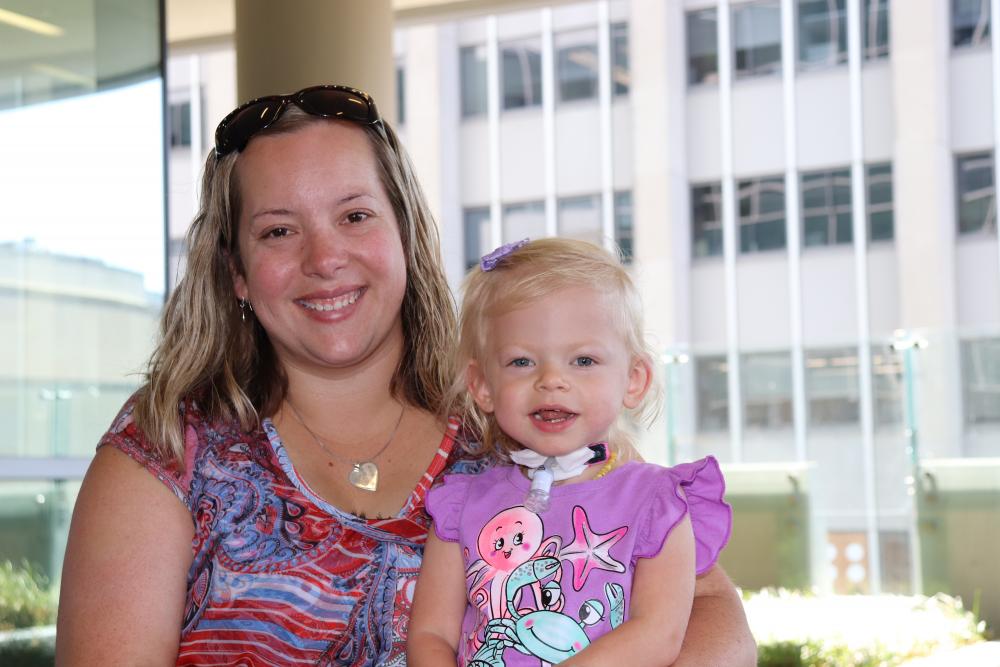 Denise Gentry enjoys the August sun on the balcony at Children’s Hospital of Richmond at VCU with her daughter Brooklynn. Since Brooklynn was born three months premature and battled in the NICU for six months, Denise and her family have been regulars at The Doorways when Brooklynn receives care on the MCV Campus.