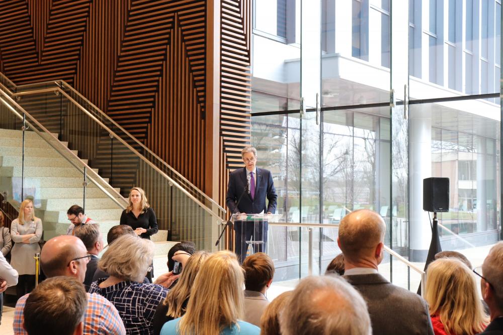 Harry Thalhimer, MCV Foundation board chair, addresses the audience in the atrium of the new College of Health Professions building during the facility’s ribbon cutting.