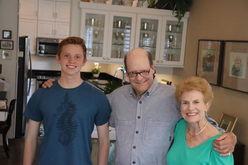 Ross Mackenzie (center), embraces his grandson Cole Mackenzie and his wife Ginni at Ross and Ginni’s home in Richmond.