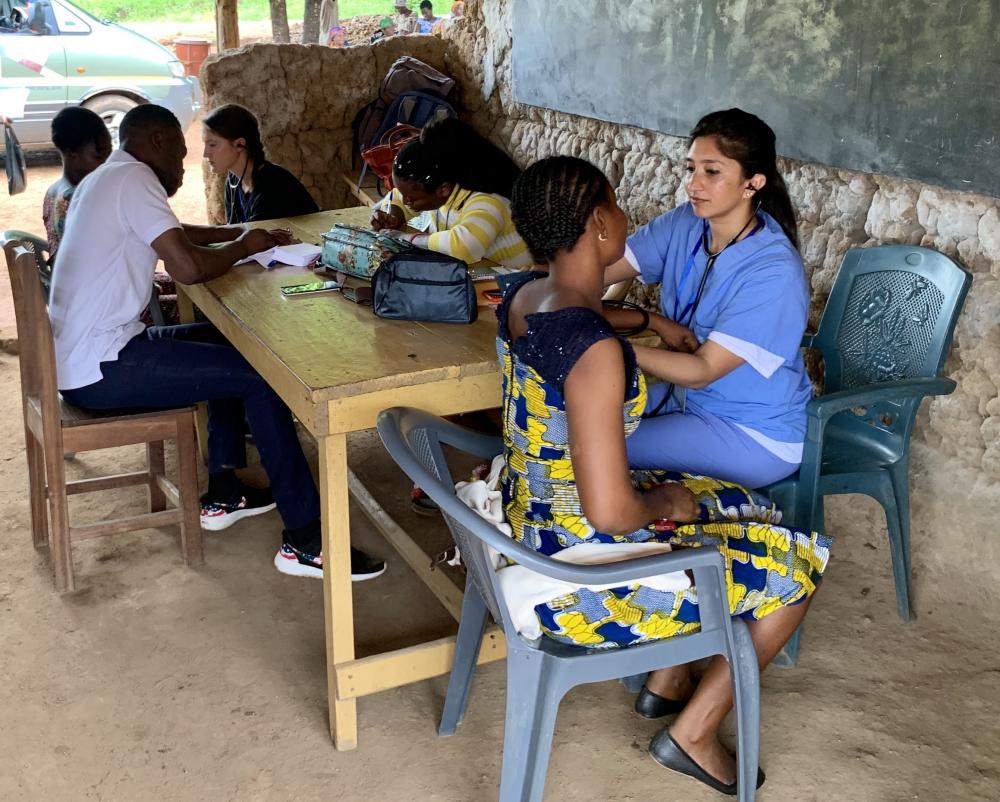 Saba Ali, a VCU School of Medicine student, reads the blood pressure of a woman who has come to the clinic where Saba and her classmates were working in Ghana. Photo courtesy of Nicole Karikari