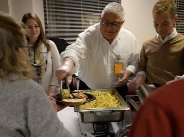 Dr. Marlon Levy (center) and Hume-Lee staff served dinner to guests of The Doorways on Jan. 31.