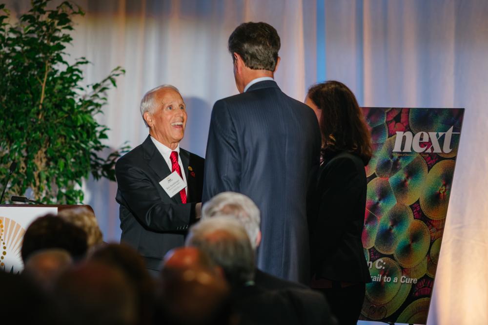 Bob Hershberger presents a gift to the VCU Weil Institute at the MCV Foundation Discovery Series event in September.
