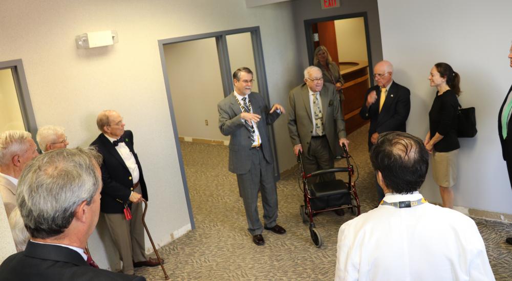F. Gerard “Gerry” Moeller, M.D., director of the VCU C. Kenneth and Dianne Wright Center for Clinical and Translational Research, leads a tour of the 6,000-square-foot space on Cary Street in Richmond that will soon be renovated to become the new home to the center’s biomedical informatics function. 