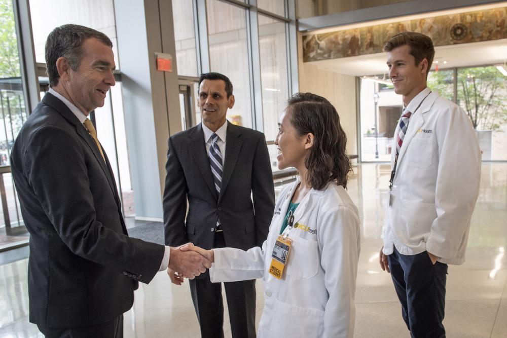 Gov. Ralph Northam and VCU President Michael Rao, Ph.D., meet with School of Medicine students. Photo: Allen Jones, VCU University Marketing