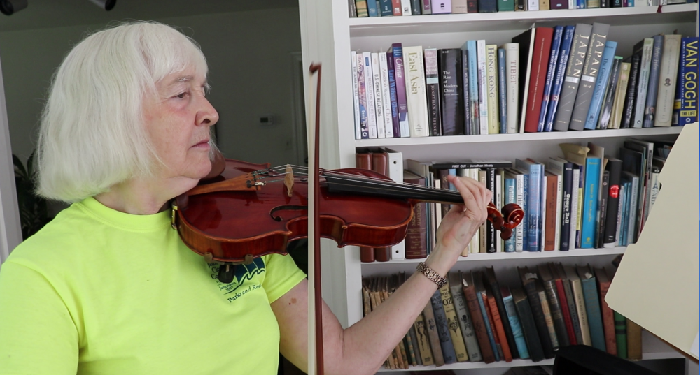 Nancy Canning plays a Scottish fiddle tune at her house in Williamsburg. When Nancy experienced severe depression in 2016, she stopped playing music and severed ties with several other favorite activities. Since her recovery, she has formed a quartet to play classical music and has also taken up the Scottish fiddle