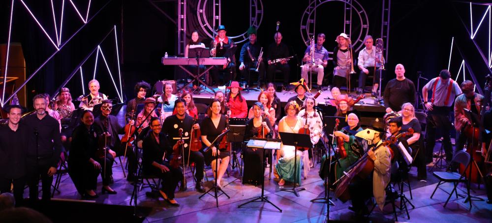 The VCU Health System Orchestra — known as Music and Medicine — pauses for a photo following their Halloween performance at Firehouse Theater Oct. 16.
