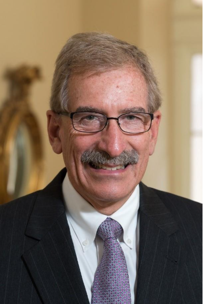 A person in a suit and tie

AI-generated content may be incorrect.