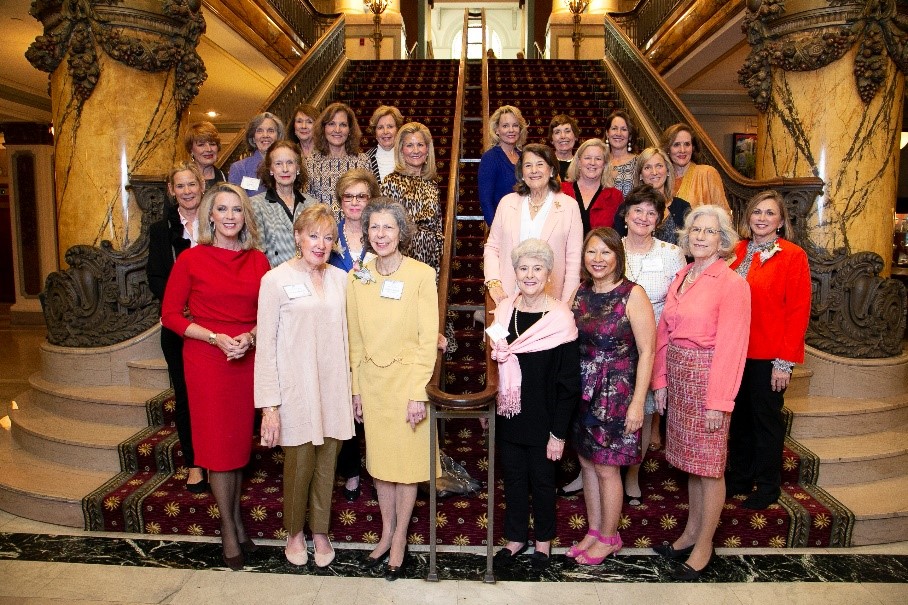 Adrienne Maxwell (front-center, in yellow), has dedicated her time and leadership to the Massey Cancer Center for almost 30 years. Here she stands with members of the Women & Wellness Legacy Committee in 2019.