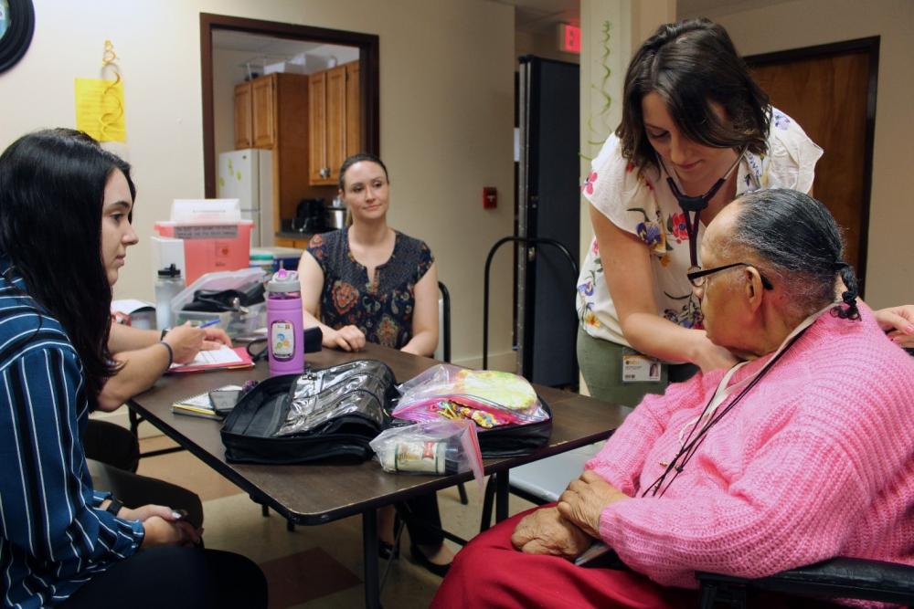 A nurse practitioner student examines a resident at one of the VCU School of Nursing’s Richmond Health and Wellness Program sites. Scholarships for students keep a world-class education within reach for aspiring nurse practitioners. Photo Courtesy of VCU School of Nursing