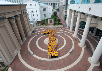 Students making a 1 on campus