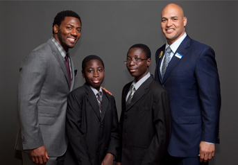 Pittsburgh Steeler Ryan Clark, Darryl Klu, Darren Klu and former Steeler James Farrior pose at the event.
