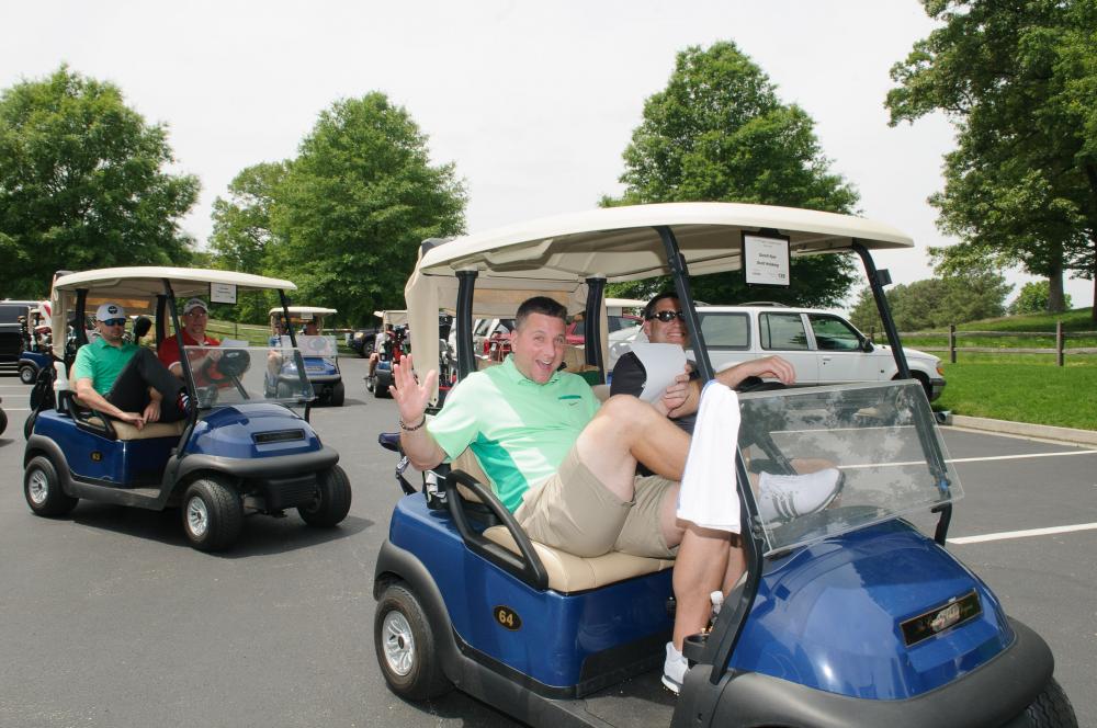 Golfers in a golf cart