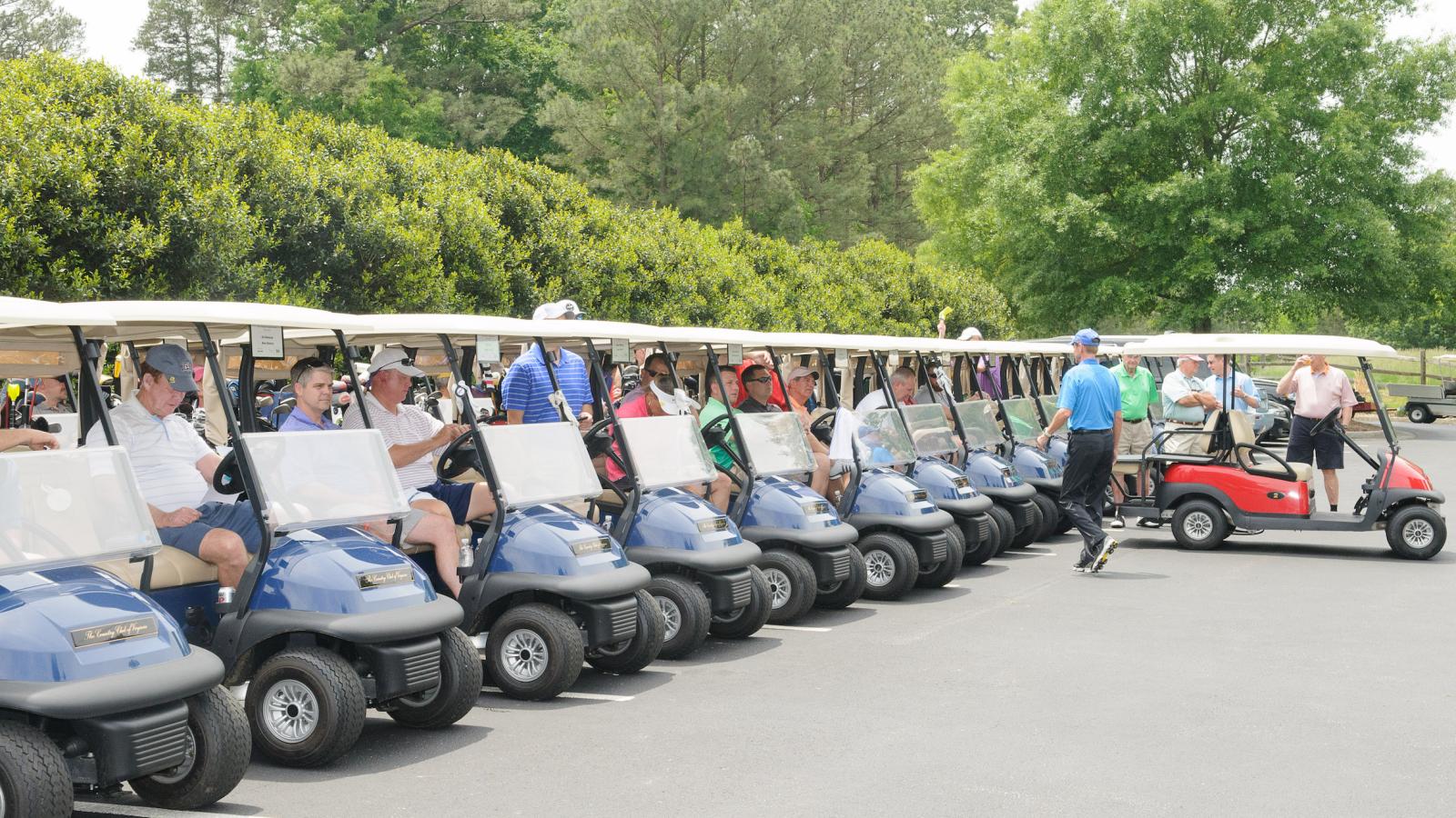 Golf carts lined up at the Harper's Hope tournament