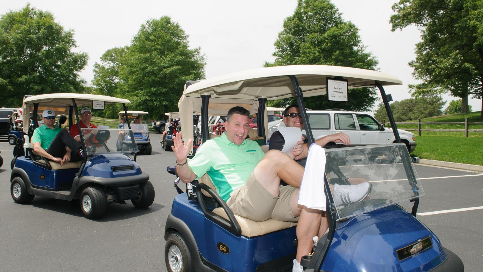 Golfers in a golf cart