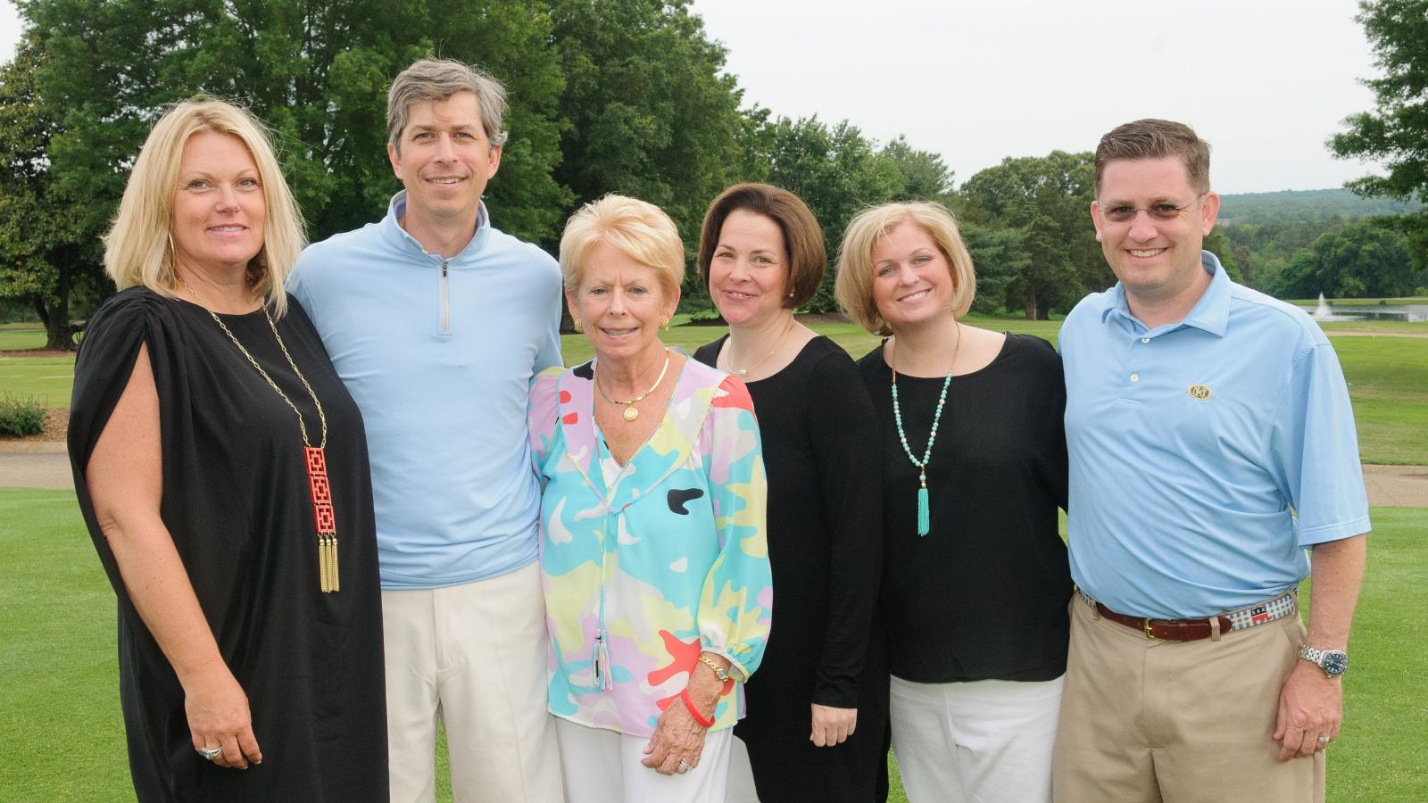 Group standing at golf course