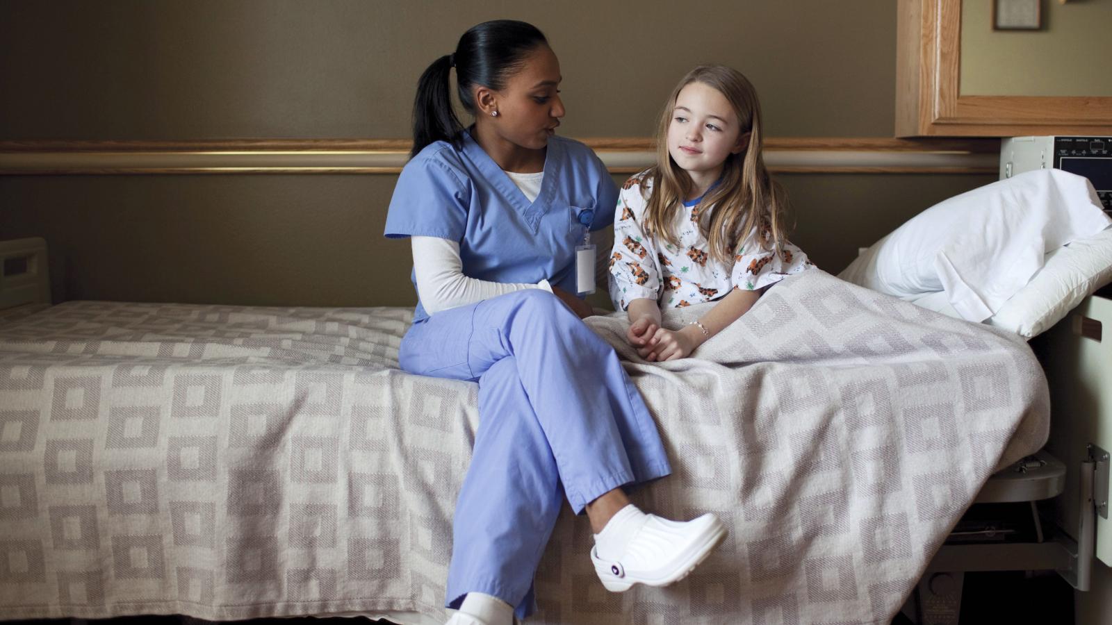 nurse and child talking