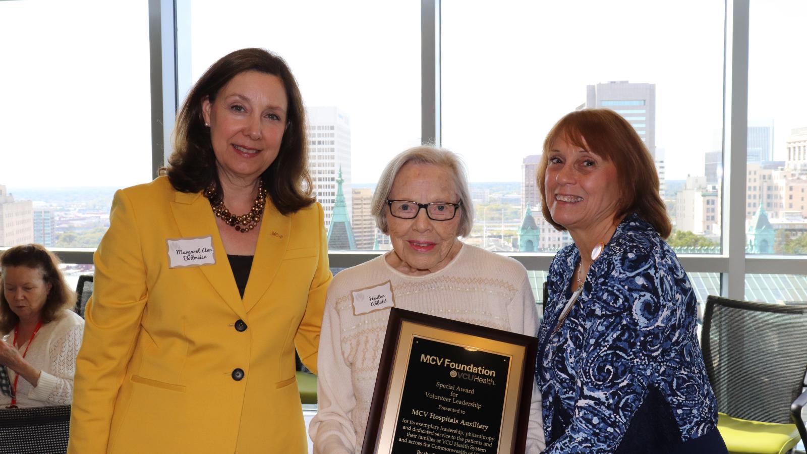 Margaret Ann Bollmeier (left), MCV Foundation president, with Hester Abbott (center), one of the MCV Hospitals Auxiliary’s founding members, and Ginny Little, the auxiliary’s current president.