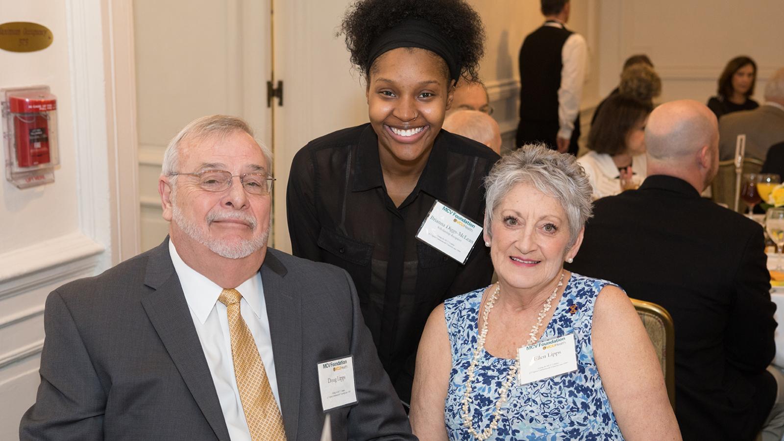 Students pose with donors.