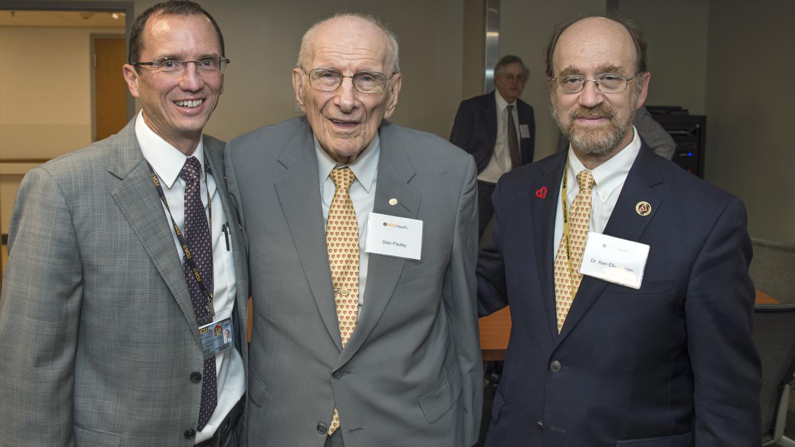 William Hundley, M.D., director of the Pauley Heart Center, spends time with Stan Pauley and Ken Ellenbogen, M.D., chair of the Division of Cardiology, after the ribbon cutting at VCU Health’s new Cardiac Imaging Suite. Photo: Kevin Morley, VCU University Marketing
