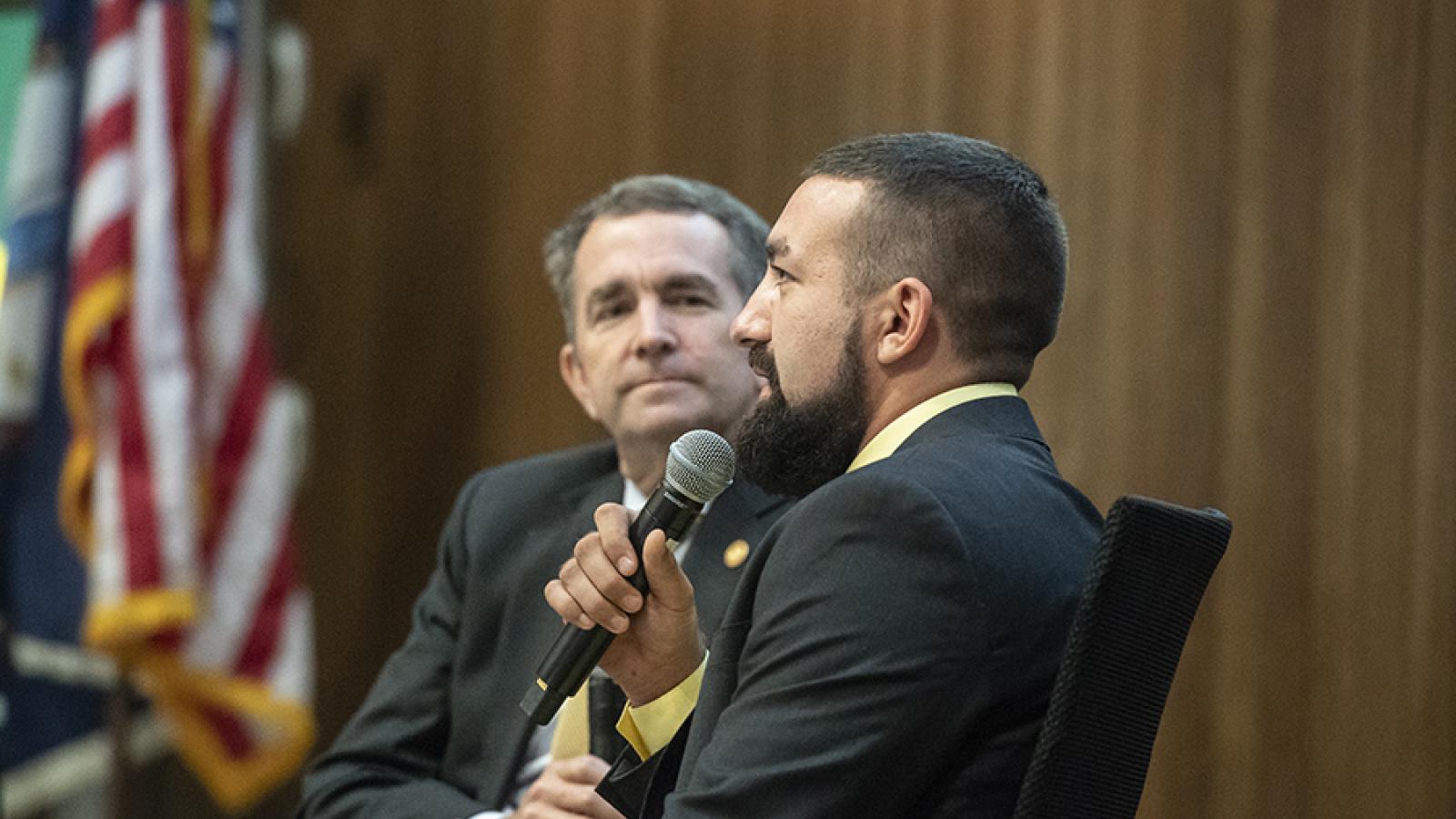 Ryan Hall speaks with Governor Ralph Northam in front of MCV Campus students, faculty and staff about his struggle with opioid addiction, which began after he sufferred an injury at a high school football game. Photo: Allen Jones, VCU University Marketing
