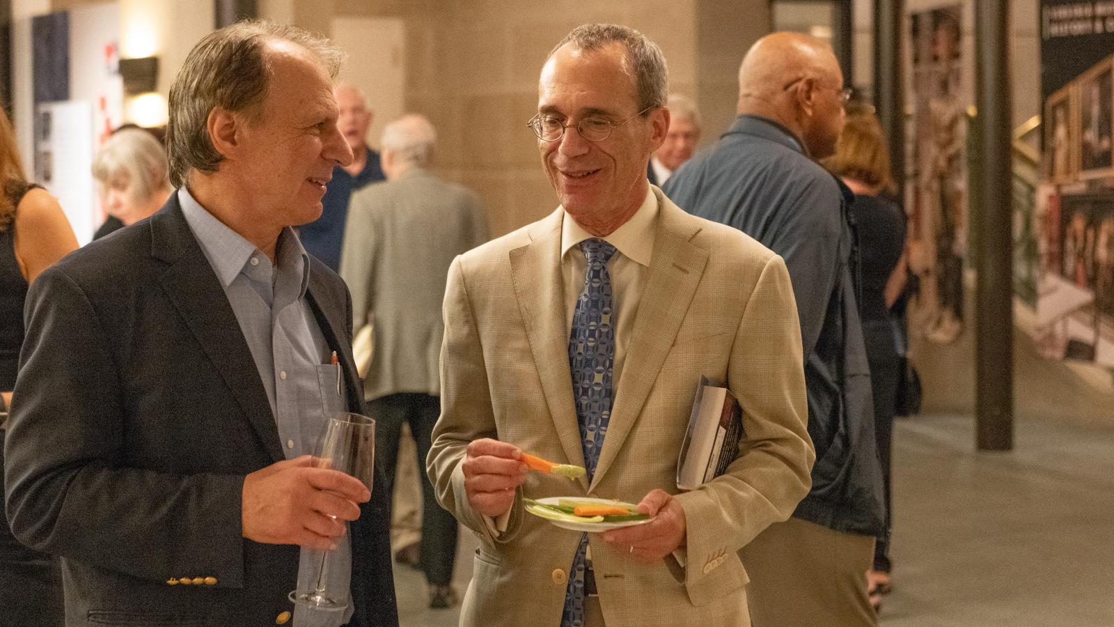 John M. Barry (left), author of “The Great Influenza: The Story of the Deadliest Pandemic in History,” and Michael Donnenberg, M.D., senior associate dean for research and research training, and professor of internal medicine at the VCU School of Medicine, discuss John’s book after the two participated in a panel at the Virginia Museum of History and Culture. Photo: Troy Wilkinson, courtesy of Virginia Museum of History and Culture.