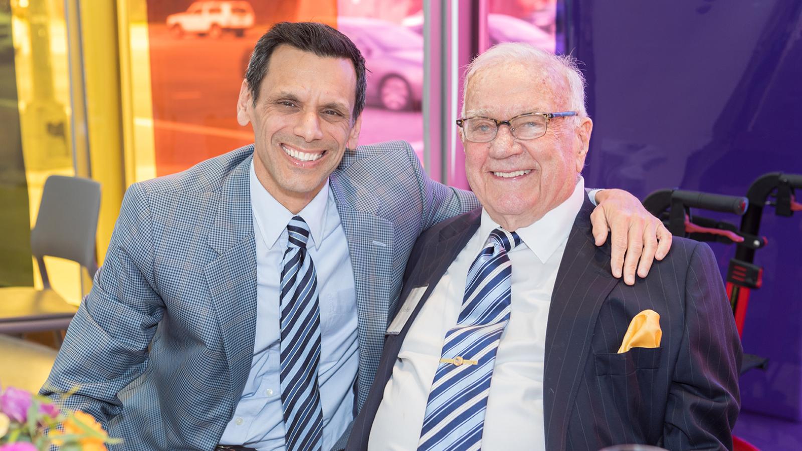 Michael Rao, Ph.D. (left), VCU president, sits with Ken Wright, one of VCU Health’s most generous supporters, at the 2019 MCV Society reception.