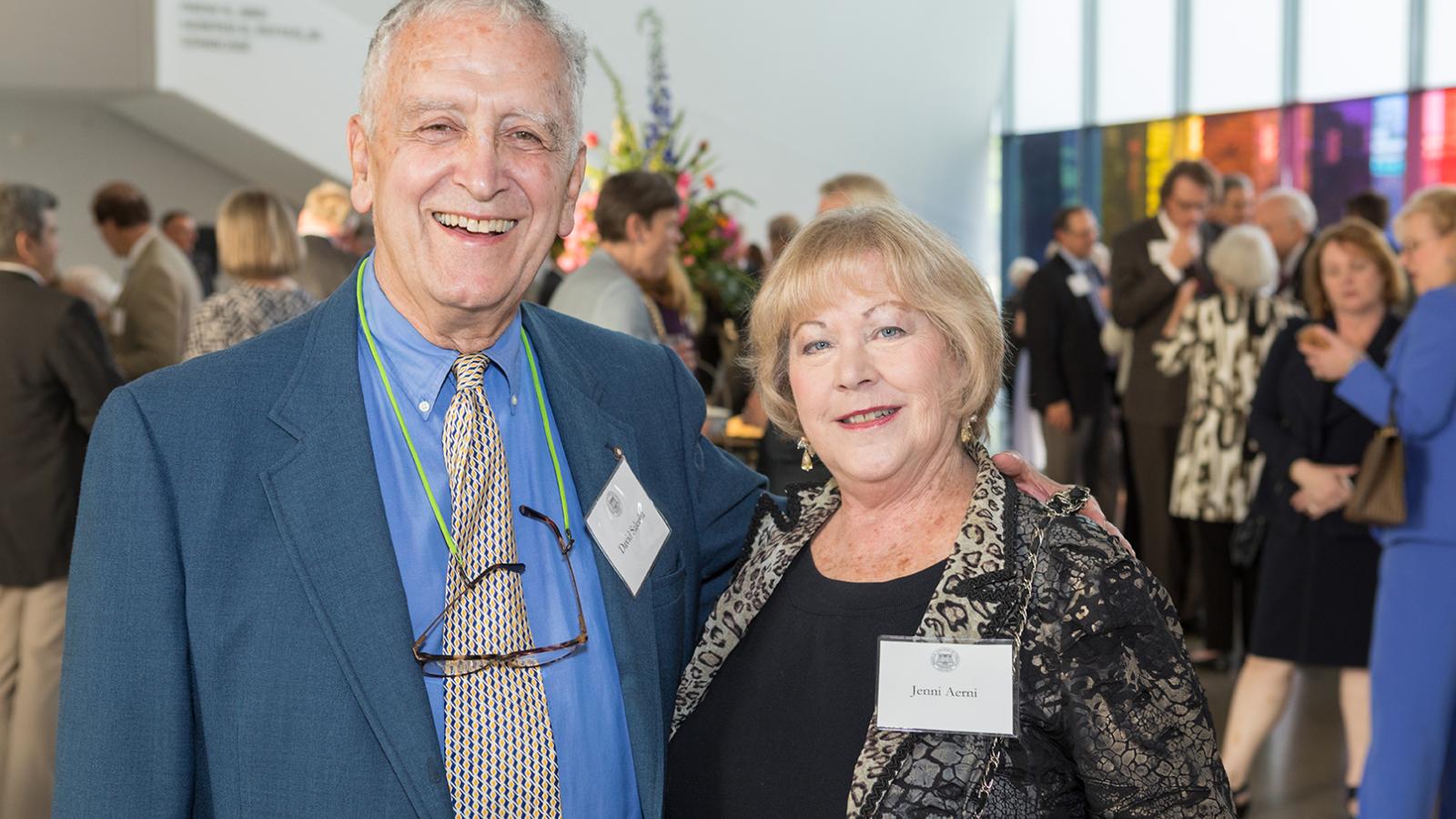 David F. Saleeba, Jr., a 1962 School of Pharmacy graduate, pauses with fellow MCV Society member Jenni Aerni at the 2019 MCV Society reception. 