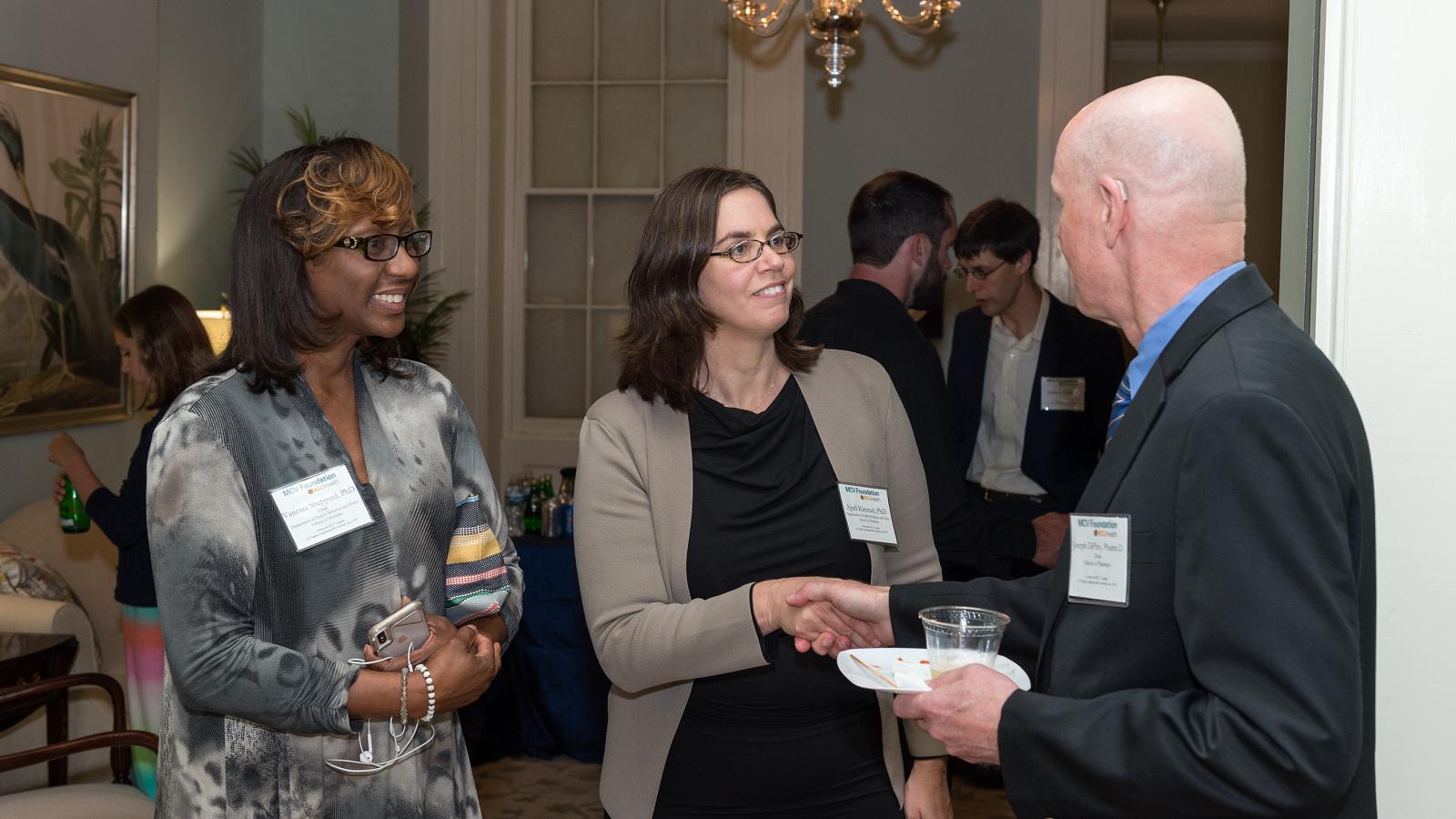 Dr. Vanessa Sheppard, Dr. April Kimmel and Dean Joe DiPiro