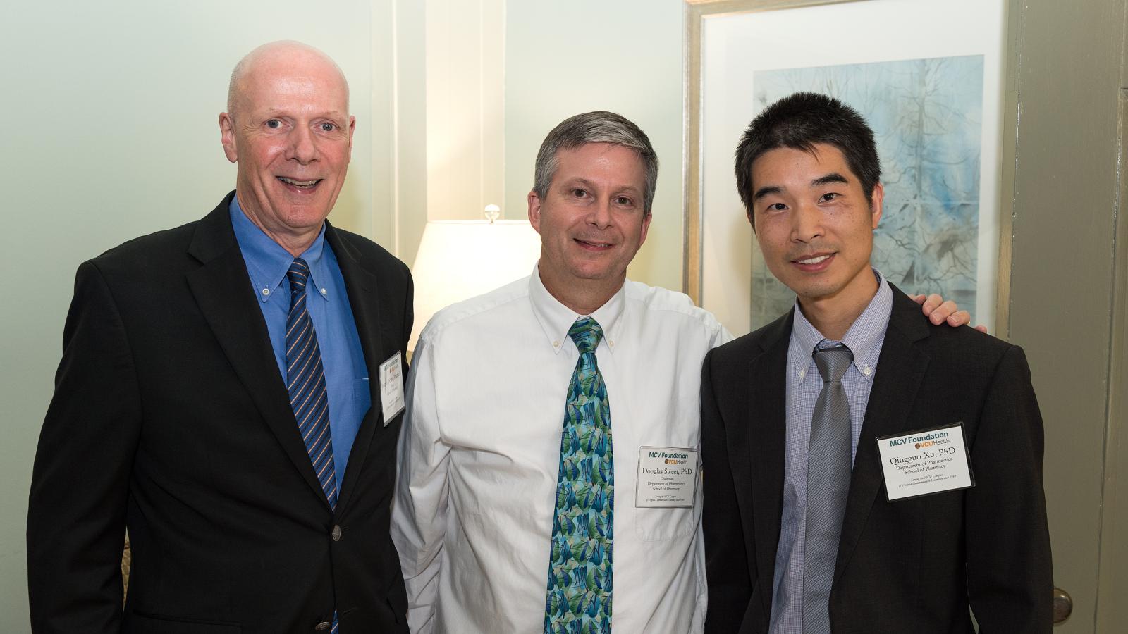 Blick Scholar Qingguo Xu with Dean Joe DiPiro and Douglas Sweet from the VCU School of Pharmacy