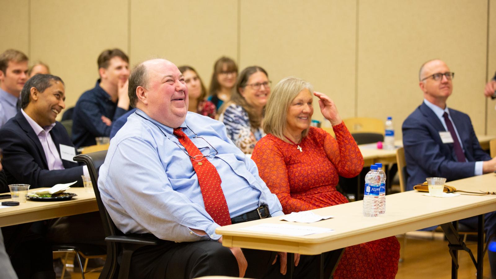 Dr. Jürgen Venitz, M.D., Ph.D., a professor of pharmaceutics at the VCU School of Pharmacy, smiles during a series of heartfelt alumni video messages played during the school’s annual Research and Career Day.
