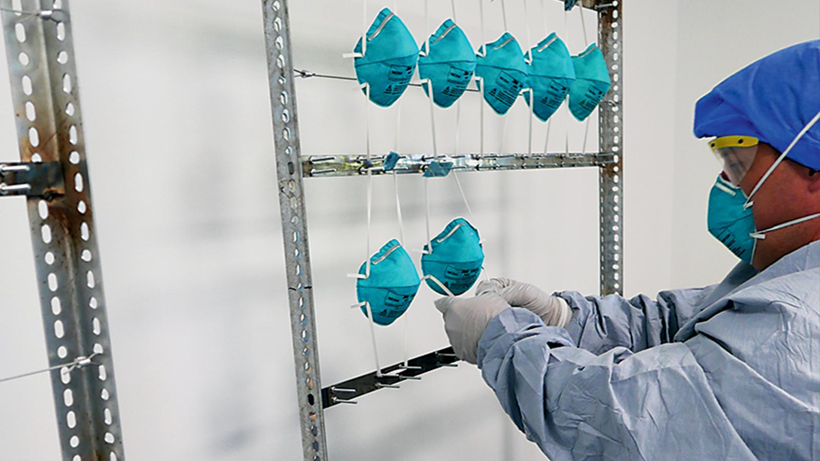 VCU Health employee hangs masks for decontamination