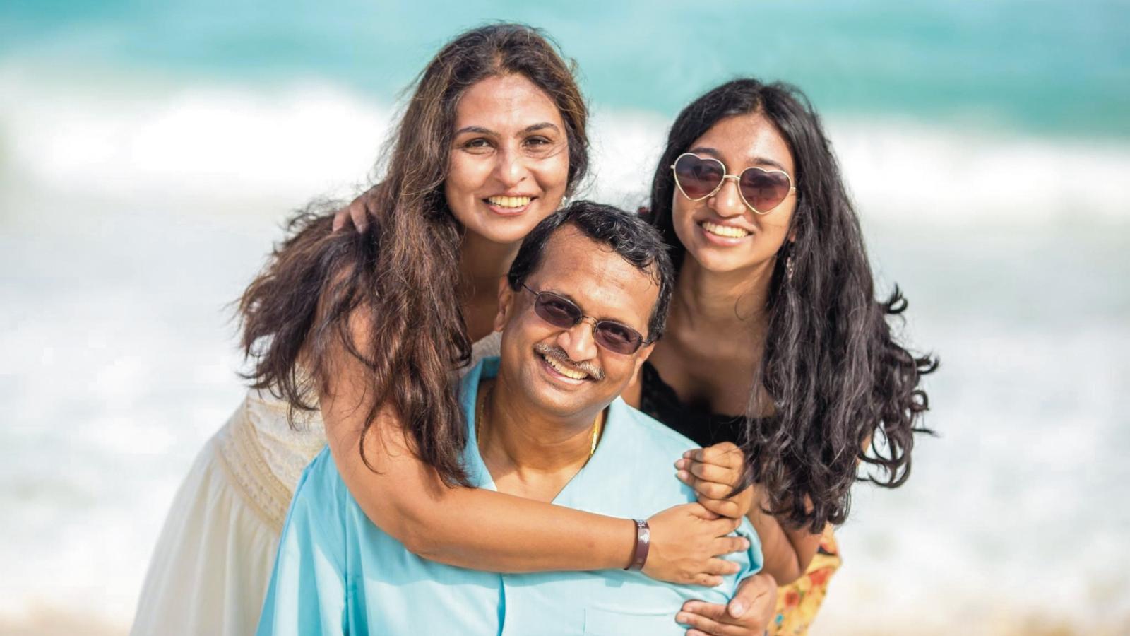 Vanitha Sekar, Ph.D., Kumar Sekar, Ph.D., and their daughter Megana
