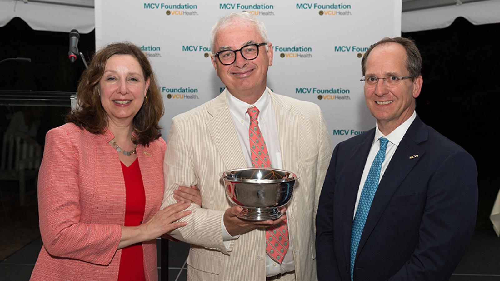Peter Buckley, M.D., with Margaret Ann Bollmeier, president and CEO of the MCV Foundation, and Wyatt Beazley IV, the foundation's board chair.