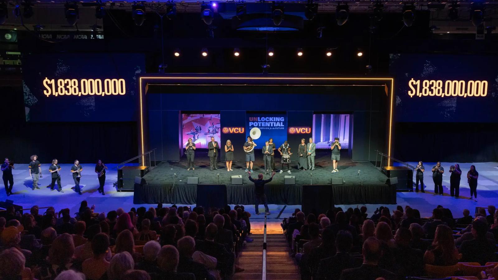 Band playing in arena during VCU campaign launch event.